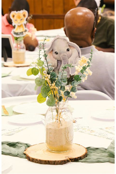 Custom event backdrop with coordinated decorative details